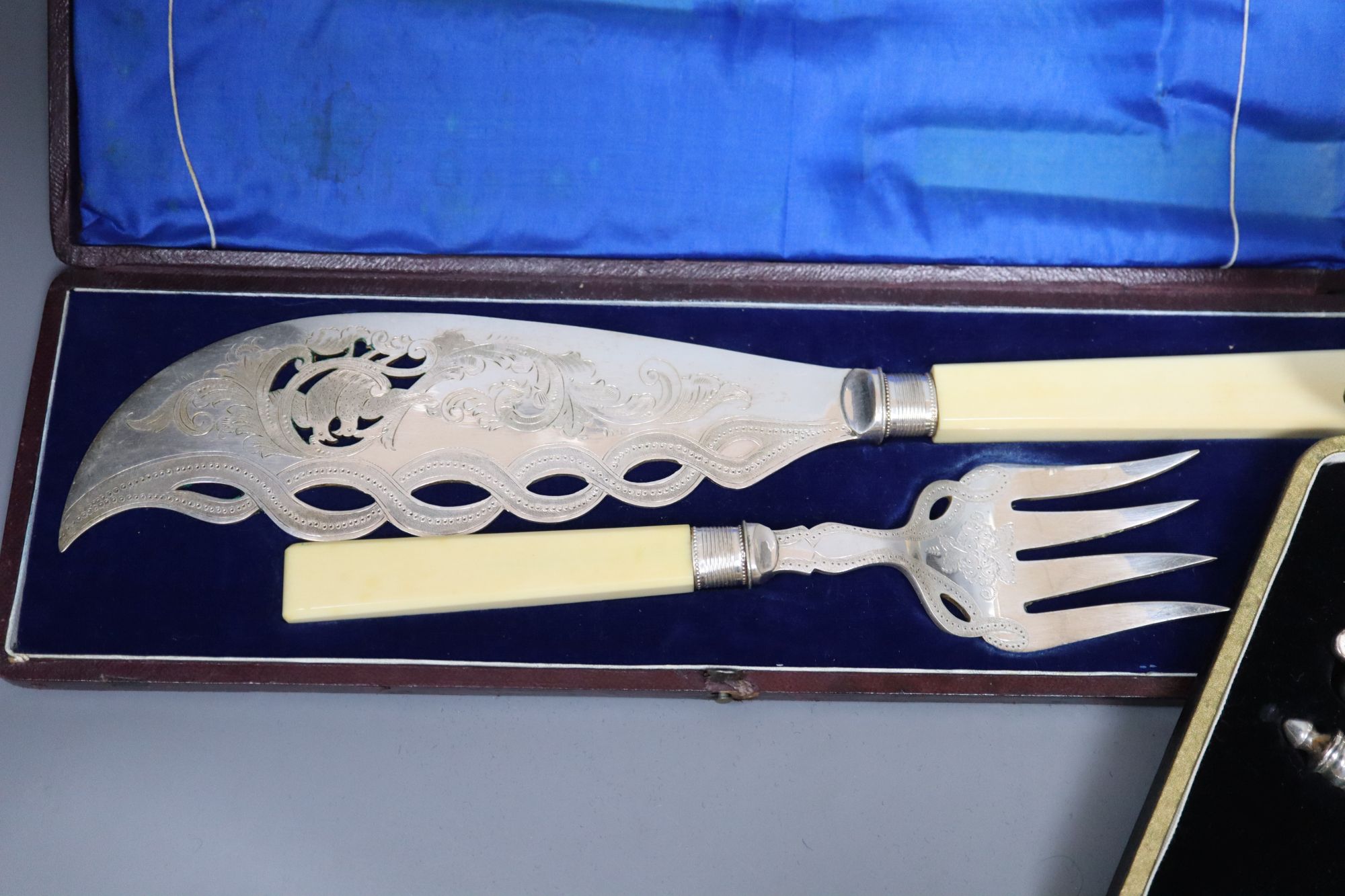 A pair of plated engraved bone handled fish servers, cased and a set of nut crackers, cased and assorted plated flatware.